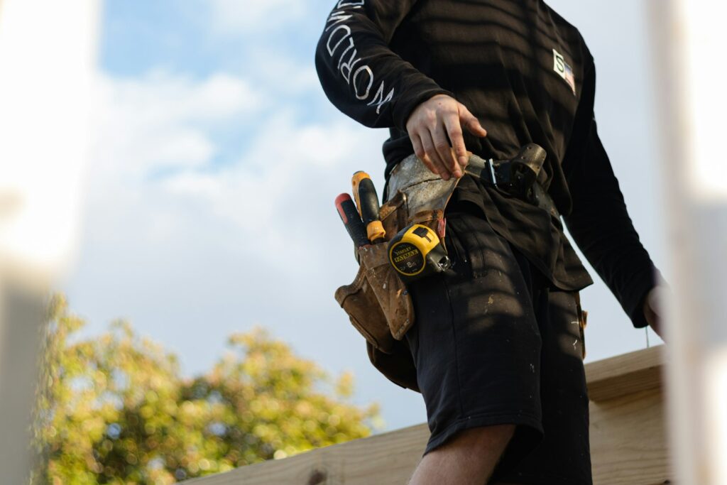 Builder laying timber on a deck