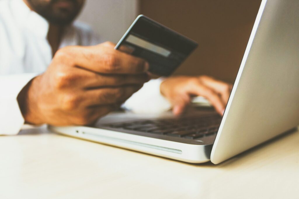 Paying online with a card and laptop