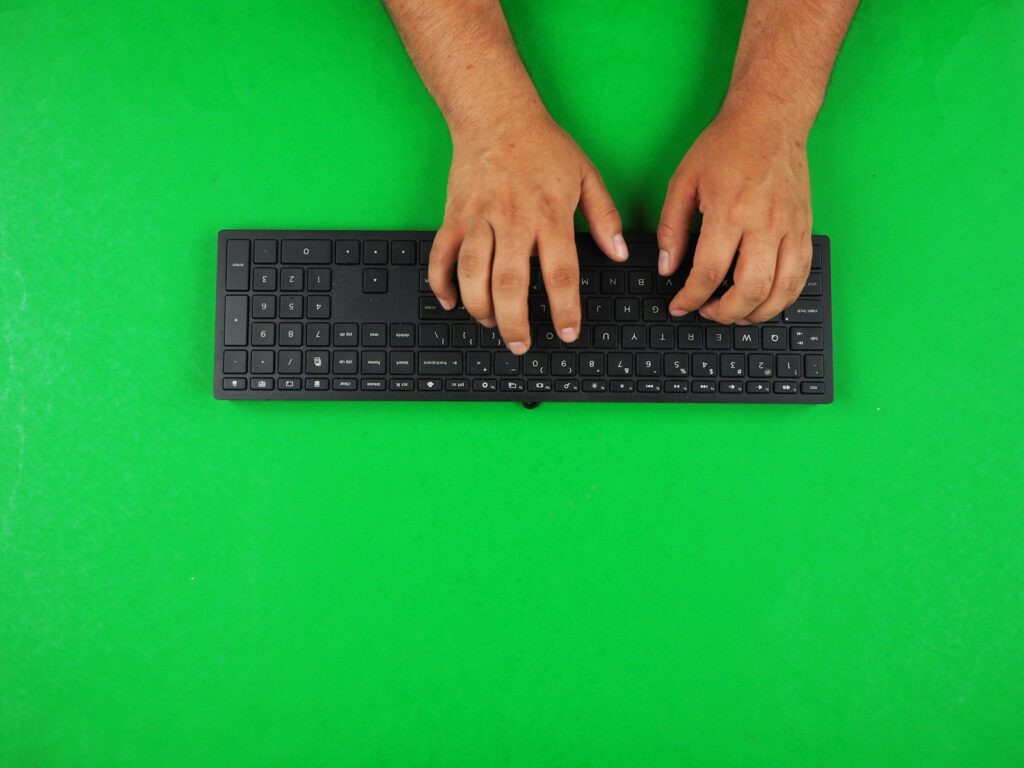 Hands typing on a keyboard